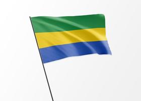 bandera de gabón ondeando alto en el fondo aislado día de la independencia de gabón. Colección de banderas del mundo de ilustración 3d foto