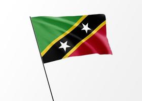 Saint Kitts and Nevis flag flying high in the isolated background  Saint Kitts and Nevis independence day. World national flag collection photo