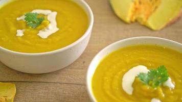 pumpkin soup in white bowl - vegan food style video