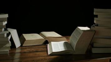 Dolly Motion Studio Shot of Big Books Stacked on a Desk at Night video