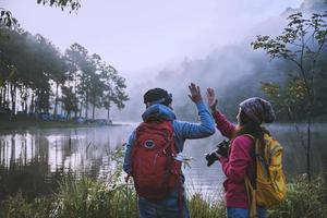 Couples who love to travel, take pictures Beatiful nature at Pang ung lake and pine forest at Mae Hong Son in Thailand. photo