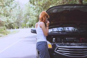 Women The car was broken on the highway. countryside. Women broken car photo