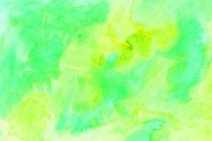 Abstract watercolor green and yellow paint background splash and handmade landscape sunset photo