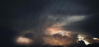 Beautiful dark black sky evening beauty and Clouds at sunset , dawn, the rays of the sun break through the clouds. Natural photo