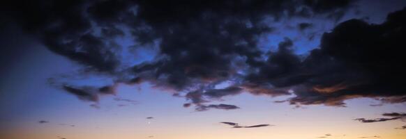 Beautiful dark black sky evening beauty and Clouds at sunset , dawn, the rays of the sun break through the clouds. Natural photo