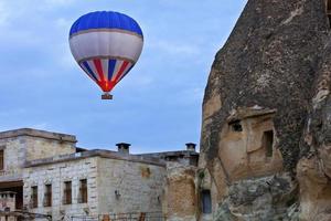 Balloon flying over the old town of Cappadocia photo