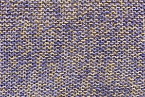 Background and texture of weaving knitted fabric from environmentally friendly flax blue-beige color photo