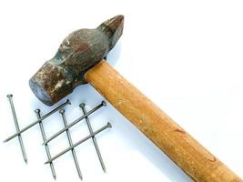 Old hammer and nails. Objects on a light background photo