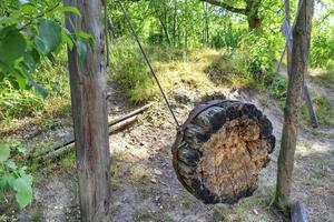 Old Ukrainian Cossack wooden shell for training on throwing knives, axes and arrows on a hill in the woods. photo