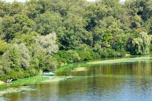 Natural picturesque landscape of the Dnipro bay near one of the river islands. photo