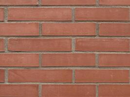 Stone wall perfectly organized,brick red texture from Rock wall Background Texture photo