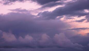 Beautiful dark white and blue sky evening beauty and Clouds at sunset , dawn, the rays of the sun break through the clouds. Natural photo