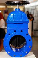 Cast iron metal shut-off industrial gate valve with a rubber wedge. photo