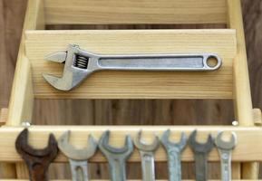 Old Construction tools on wooden slats close-up photo