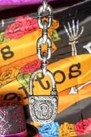 Large metal decorative padlock on a chain for the celebration of Halloween.