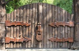 Old and mysterious wooden gate - entrance to the magic forest photo