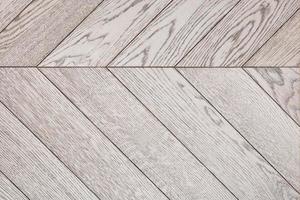 Wood planks with a vibrant gray texture are neatly stacked side by side. photo