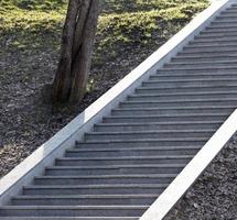 Steps of a granite ladder rising upwards photo