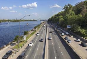 The city route of Kiev goes along the embankment of the Dnieper River photo