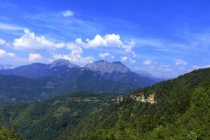 Mountain panoramic landscape of the rocky ridges of Montenegro overgrown with dense forest photo