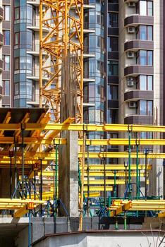 Construction of new buildings in a monolithic-frame way using a system with a system of metal scaffolding. photo