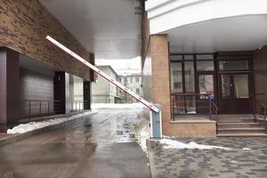 Automatic barrier gates to entry the courtyard of the building photo