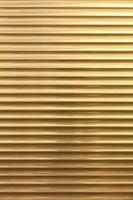 The background and texture of metal blinds golden color. photo