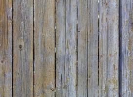 Texture of weathered old gray wooden fence photo