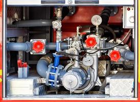 A powerful water pump is located in the cargo compartment of an equipped fire truck. photo
