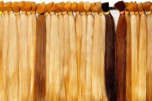 Healthy hair tufts of long light shades, natural, wheat-colored, chocolate-colored, brown. photo