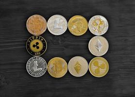 Coins crypto curency lie on a black wooden board photo