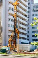 Drilling rig for driving concrete piles at a construction site. photo