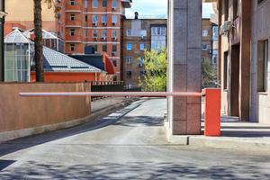 Automatic barrier to enter the courtyard of a residential building. photo