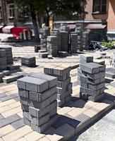 Stack of paving stones on construction site on the street photo