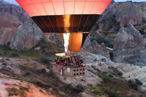 A balloon is flying over the valley in Cappadocia. 12.05.2018. Turkey. photo