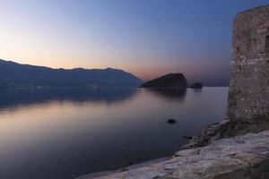 View of the island of St. Nicholas in the Adriatic Sea from the fortress of the ancient Citadel photo