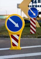 bright yellow-blue road sign detour on the right photo