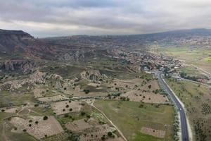 Balloons fly over the valleys in Cappadocia photo