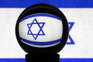 Flag of Israel in reflection on a crystal ball photo