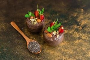 Chia pudding with cocoa, chocolate and nuts in almond milk