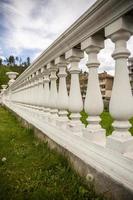 Fragments of white marble stone railings. Bridge guardrail. photo