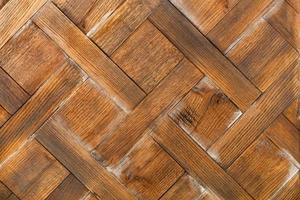 Rectangular old planks of transverse wooden planks are neatly laid out with a diamond pattern. photo