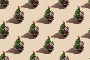 New Year's card close-up a snowman with a Christmas tree on a beige background with a hard shadow. seamless pattern photo