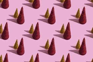 Colored Christmas trees on a pink background. Christmas concept, seamless pattern photo