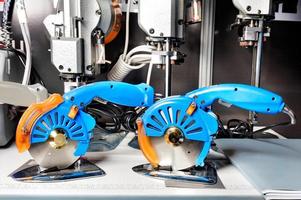 Electric textile saws for cutting fabrics in production, close-up. photo