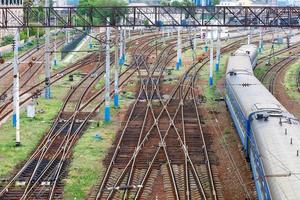 Railroad network with moving train carriages, top view. photo