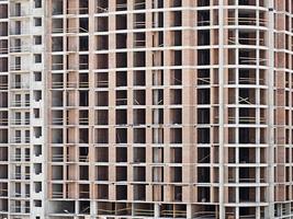 Monolithic frame construction on facade - building under construction. photo