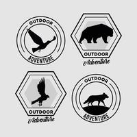 cuatro emblemas de animales salvajes. vector