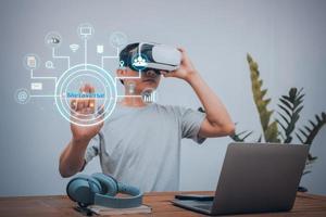 Man wears virtual reality glasses in Metaverse to link information online photo