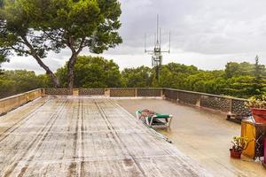 Rainy roof terrace with sun lounger in the hostel Mallorca. photo